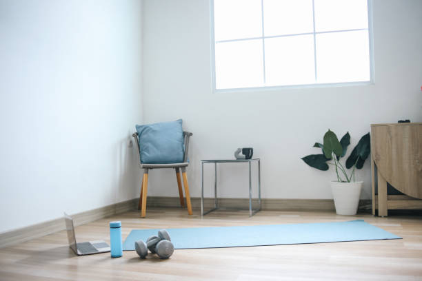 Living room setup with chair and water bottle for home exercises
